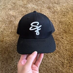 Black and white San Francisco 49ers snapback hat; excellent condition